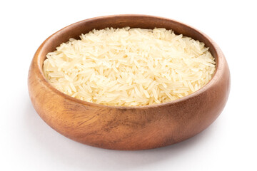 Long Basmati rice in wooden bowl isolated on white background. Macro. Vegetarian food concept