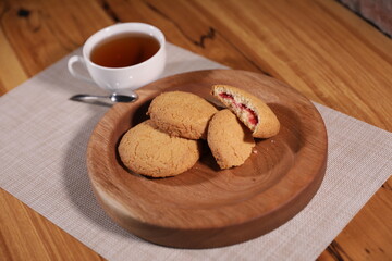 berry tea and a decorative wooden plate is very beautiful for vegetables and cookies, sweets and desserts as an element of decor for interior design