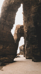 Monumental cliff arches lit by the morning sunlight 