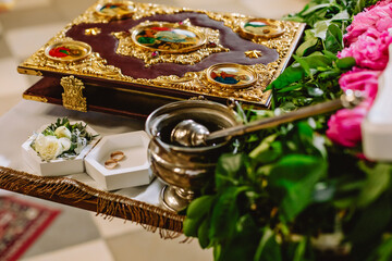 Bowl of candles in the church on a pedestal in front of the altar.