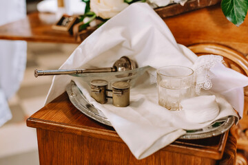 Items for the baptism of a child at the altar in the church