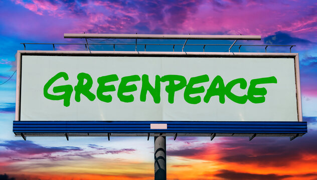 Advertisement billboard displaying logo of Greenpeace