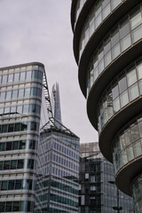 Obraz premium Abstract scene of multiple modern facades of buildings in London, UK. Financial district, company headquarters. 