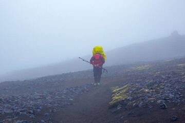 The tourist is in a continuous fog in the highlands in Iceland