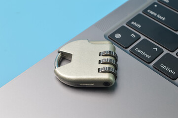 Steel padlock and computer keyboard. Internet security and data protection concept.