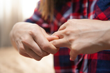 young woman has a sore finger