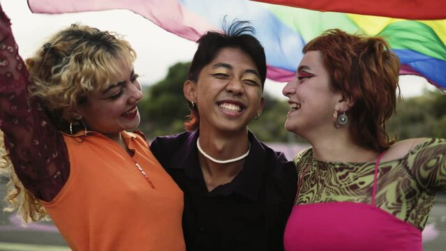 Happy gay friends hanging out together - LGBT and youth people lifestyle concept 