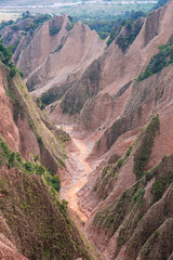 Taiwanese big canyon with an eroded red dirt creek 
