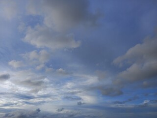 gray stratocumulus cloud and blue sky