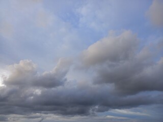 Stratocumulus cloud with gray colour and blue sky