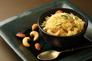 Moong dal halwa is a classic Indian sweet dish made with moong lentils, sugar, ghee and cardamom powder