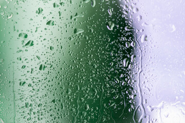 Green and white behind rainy window