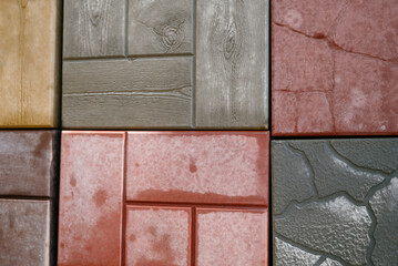 Texture of different colored patterned paving slabs . Modern road surface.