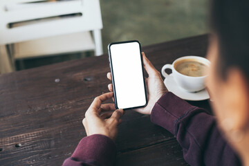 cell phone blank white screen mockup.hand holding texting using mobile on desk at office.background empty space for advertise.work people contact marketing business,technology
