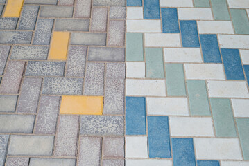 Paving slabs of different colors and shapes.Decorative cobblestones are different in color and shape.