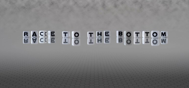 Race To The Bottom Word Or Concept Represented By Black And White Letter Cubes On A Grey Horizon Background Stretching To Infinity