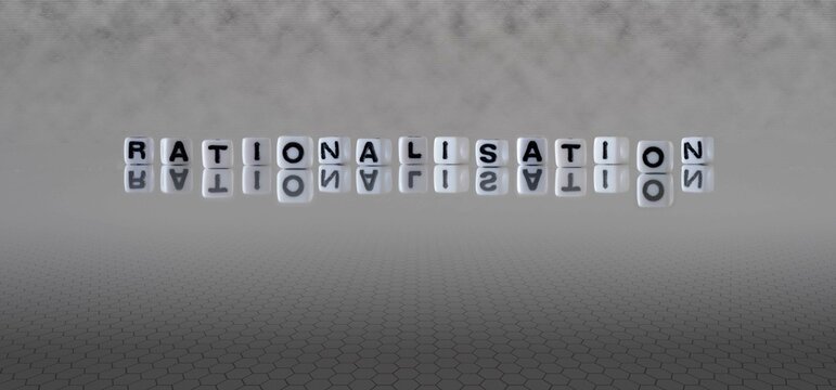 rationalisation word or concept represented by black and white letter cubes on a grey horizon background stretching to infinity
