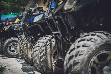 View of row dirty ATVs quad bike © romaset