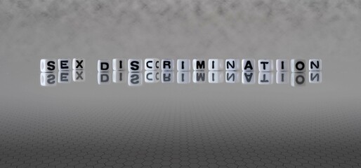 sex discrimination word or concept represented by black and white letter cubes on a grey horizon...