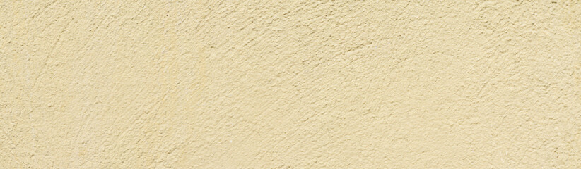 The texture of the surface of a light yellow concrete wall, cement pattern with cracks on the background with space to copy, panoramic view