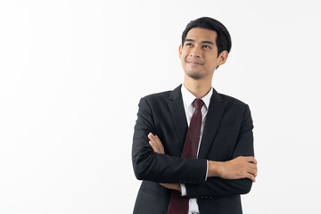 Obraz na płótnie Canvas happy young asian businessman smiling and thinking in formal suit isolated on white background.