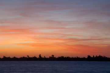 Fototapeta na wymiar Sunset on the Senegal River. Langue de Barbarie National Park. Saint-Louis. Senegal.