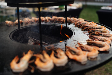 Outdoor barbecue, seafood is grilled. High quality photo