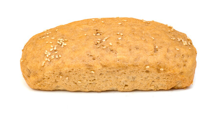 Loaf of baked whole wheat bread on a plain white background decorated with sesame seeds.