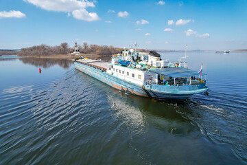 Cargo transportation. Cargo ship on the Volga river in Russia. Volga-Don shipping canal in Volgograd. Russia