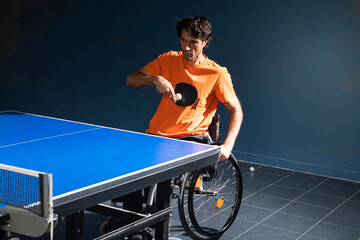 Wheelchair user playing table tennis