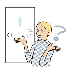 トイレの使い方がわからなくて困る外国人男性
