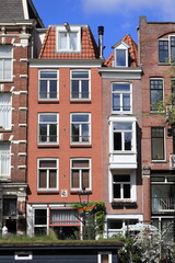 Fototapeta na wymiar Amsterdam Prinsengracht Canal Brick House Facades View, Netherlands