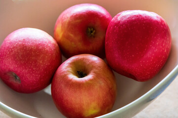Bowl of fresh red delicious organic apples