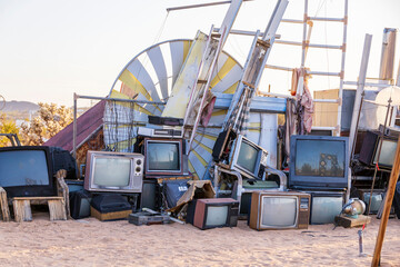 Pile of old televisions at a junk yard