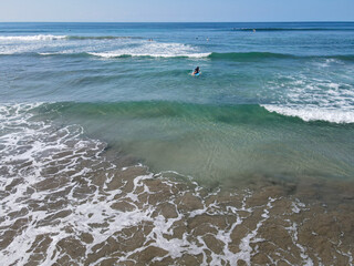 Paddling out to the waves in Costa Rica