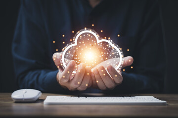 cloud technology data storag concept man's hand holding a virtual image cloud storage which is a...