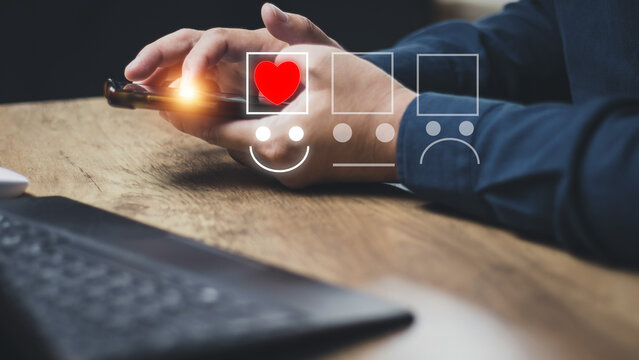 Customer service and Satisfaction concept Men's hands doing online assessments in the satisfaction rating the popular service company allows customers in order to improve and develop the organization
