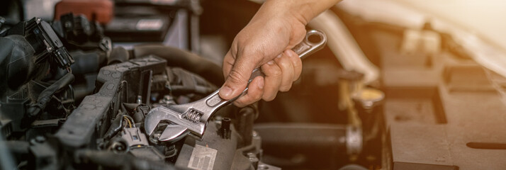 Fixing automotive engine, car service and maintenance, Repair service, repairman hands repairing a car engine automotive workshop with a wrench, Auto service,  maintenance concept, Fix car
