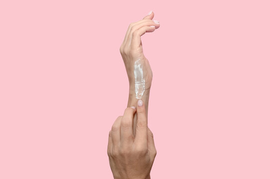 A smear of cosmetic cream on a woman's hand. Moisturizing and skin care. - Powered by Adobe