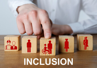 Concept of DEI - Diversity, Equality, Inclusion. Businessman and wooden cubes with images of people on table, closeup