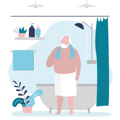 Grandfather finished taking bath. Handsome senior wipes himself off with towel after shower. Old man stands wrapped in towel in bathroom. Personal hygiene and healthcare concept.