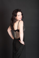 Fototapeta premium woman in dress on black background