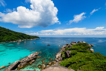 Panoramic view of Koh.8 Similan Island with white cloud and blue sky and clear water.