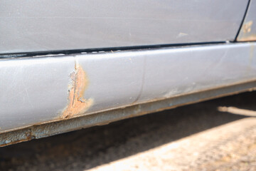 Corrosion, rust on the car body. car with Rust and Corrosion and paint bitumen. The concept of harm...