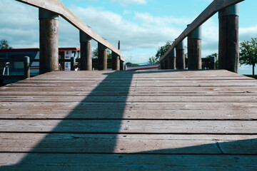 wooden bridge with a handrail on park, Dark Tone. Over the Bridge