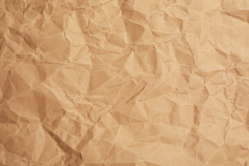 Texture of brown crumpled paper as background, closeup