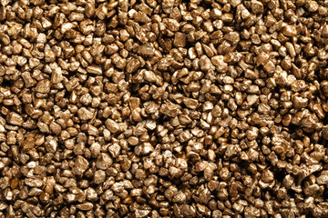 Many gold nuggets as background, top view