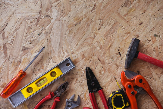 Different construction tools with Hand tools for home renovation on wooden board maintenance and reparing concept