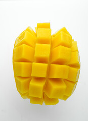 Half cube fresh mango on isolated whited background. Thai tropical fruit for dessert.