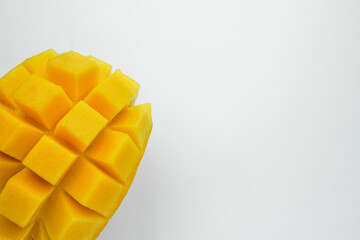 Half cube fresh mango on isolated whited background. Thai tropical fruit for dessert.